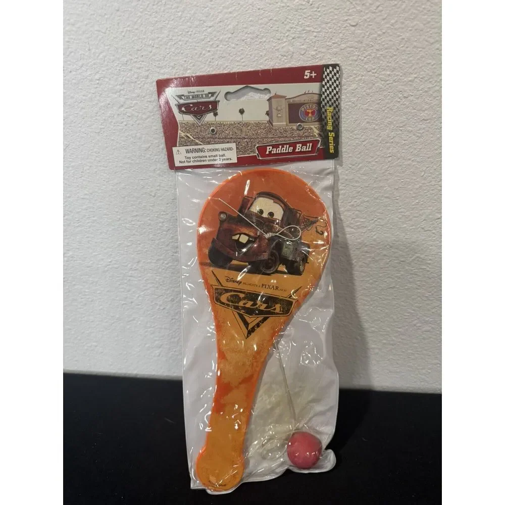 DISNEY PIXAR CARS Mater MOVIE PLASTIC PADDLE BALL RACING SERIES NEW IN PACKAGE